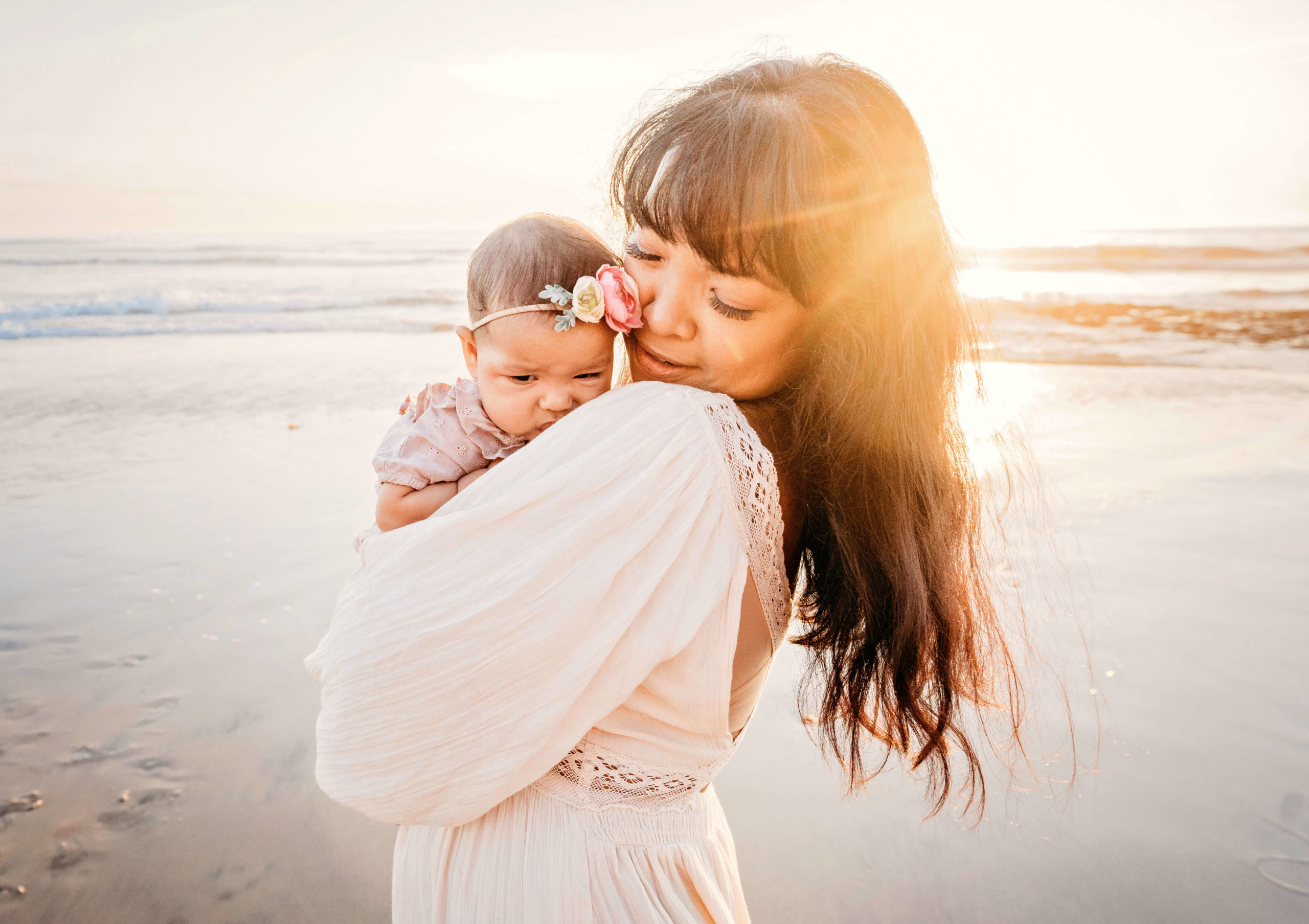 Sweet moment with mom and baby during a Carlsbad family photography session