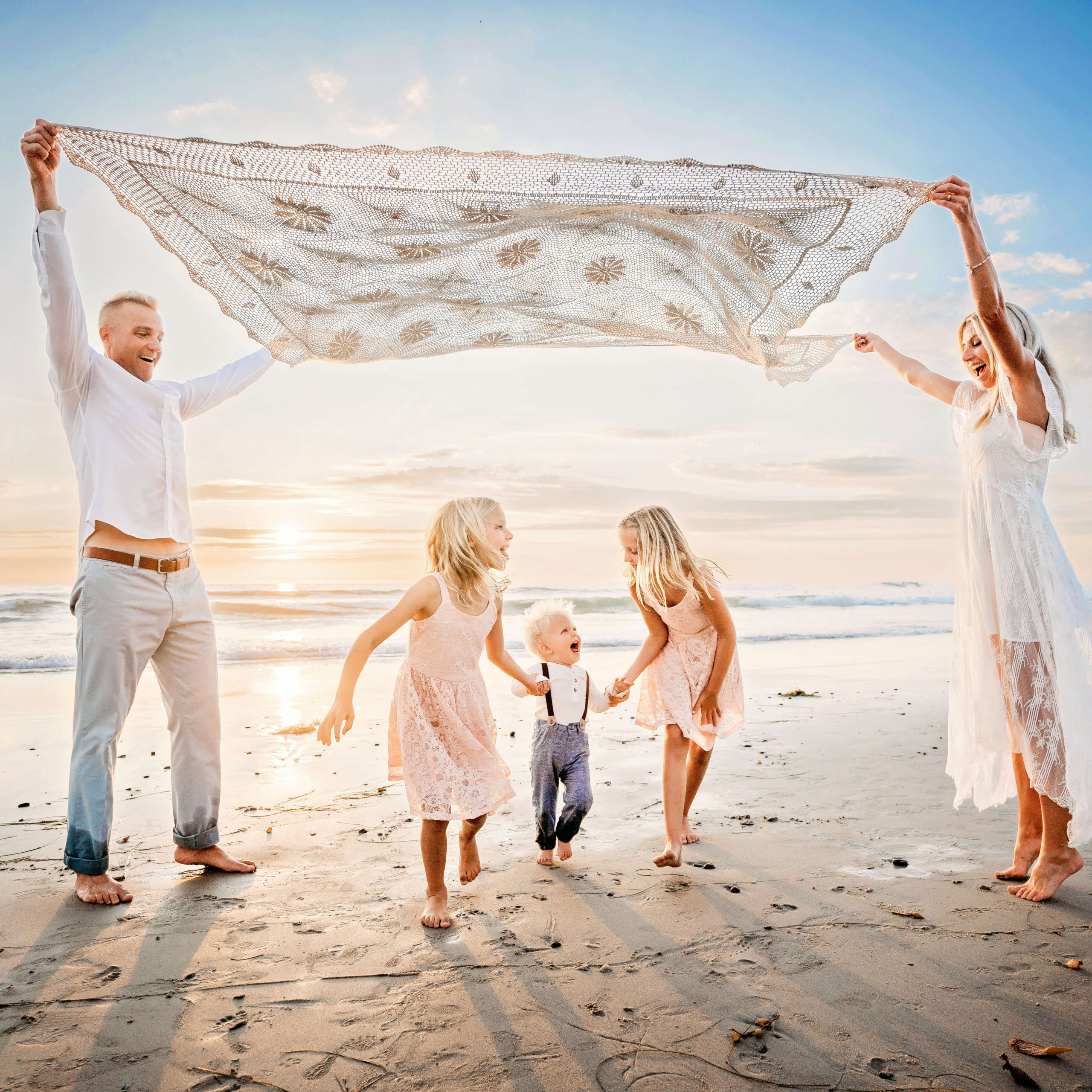 Gorgeous family beach photography session by San Diego family photographer Tristan Quigley who also specializes as a San Diego maternity photographer and San Diego newborn photographer