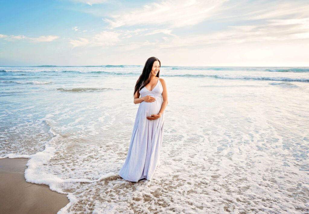 Gorgeous pregnancy mother posing on the beach during her session with San Diego pregnancy photographer, Tristan Quigley