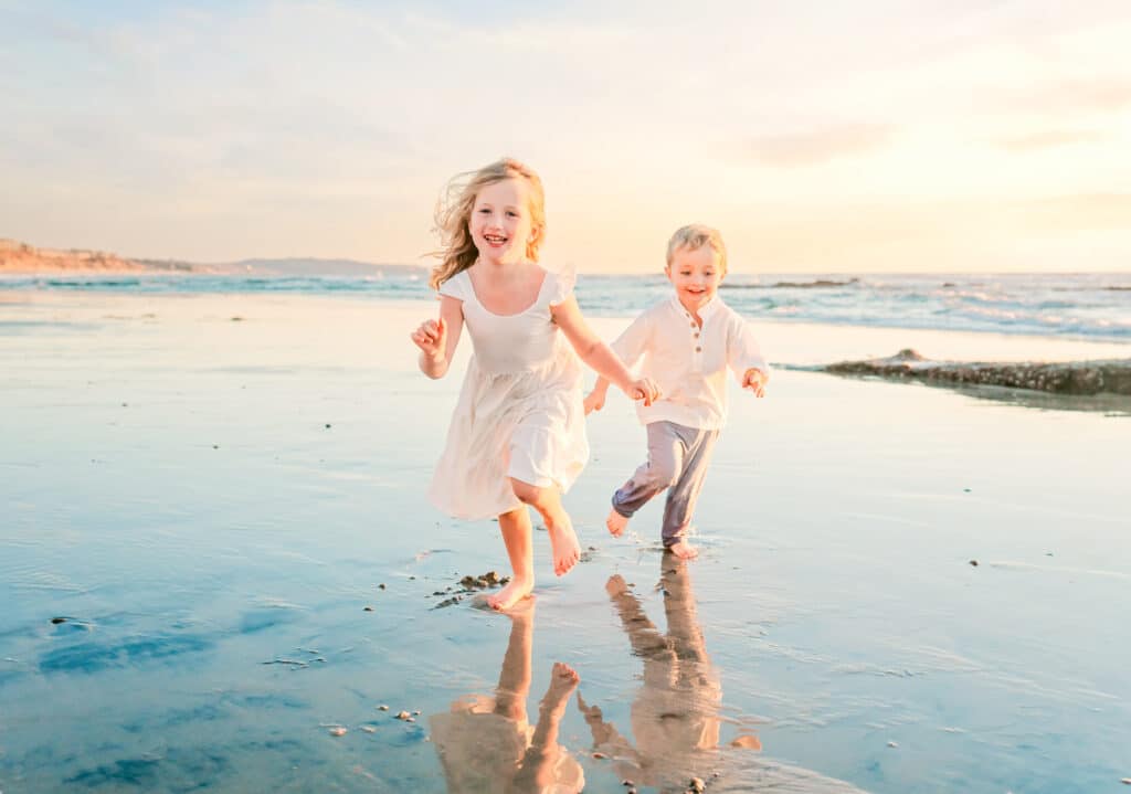 Parents and children laughing together in an Oceanside family photography session