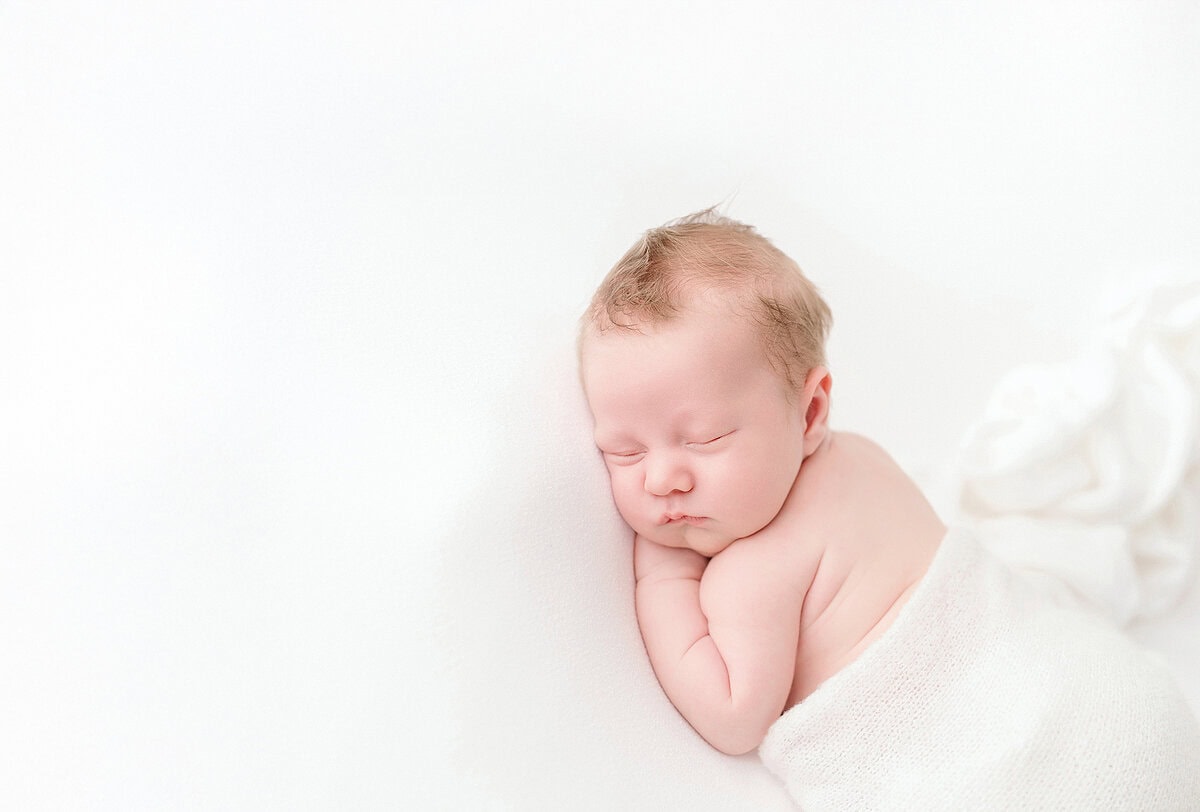 Timeless Encinitas newborn photography session with sleepy baby