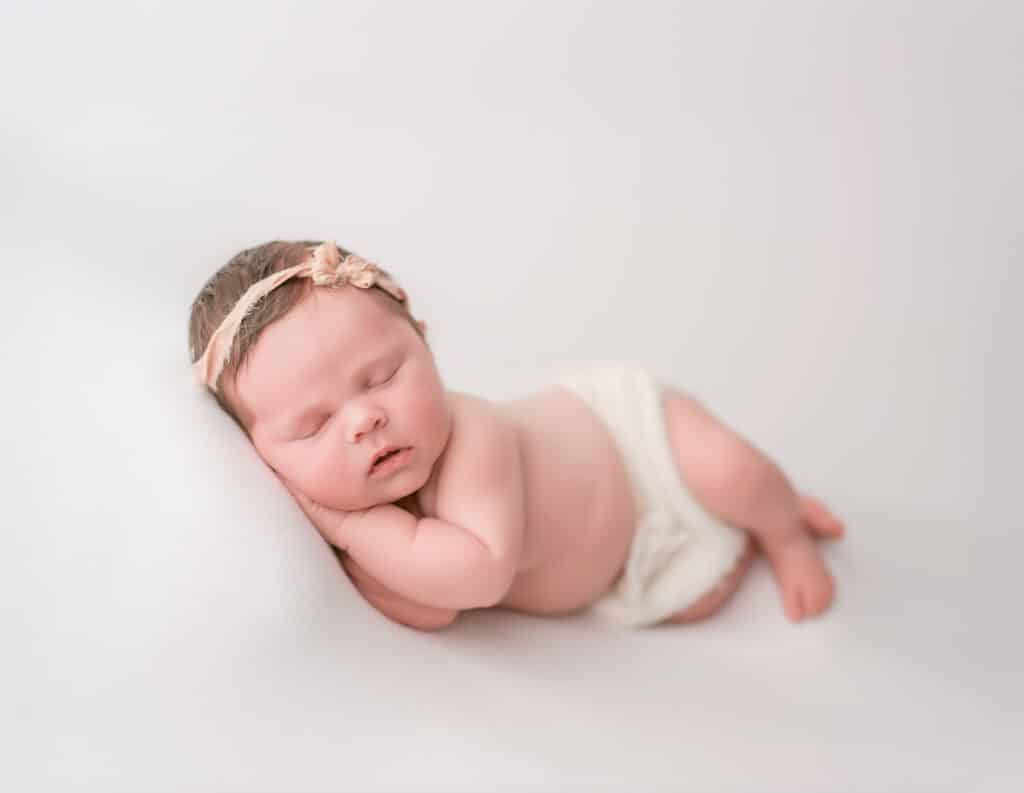 Finding The Best Carlsbad Newborn Photographer Starts with These 3 Questions 2 Newborn baby girl sleeping during her session with Carlsbad newborn photographer, Tristan Quigley