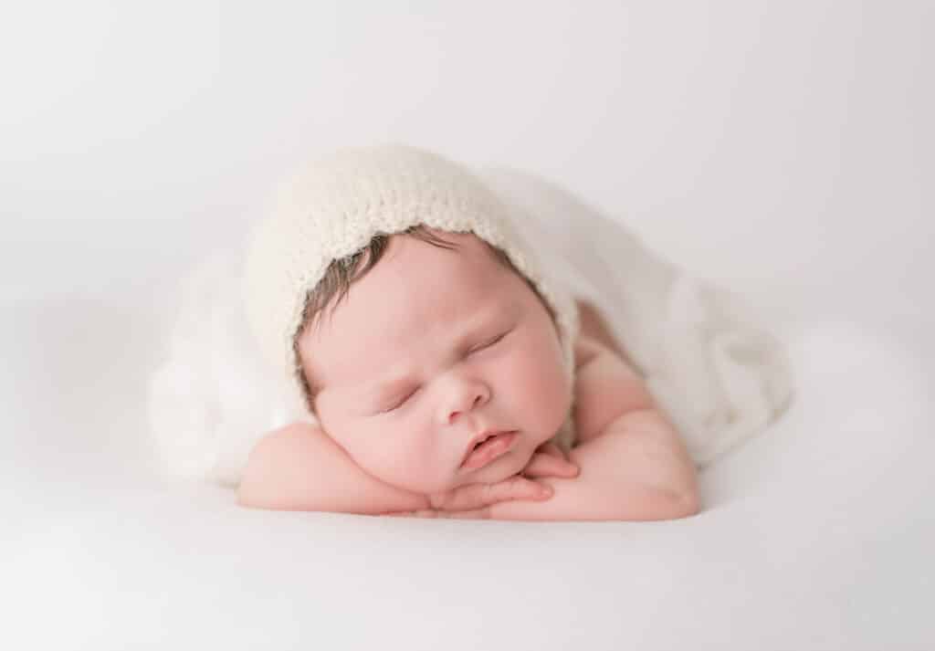 Finding The Best Carlsbad Newborn Photographer Starts with These 3 Questions 1 Adorable newborn baby girl sleeping during her session with Carlsbad newborn photographer, Tristan Quigley