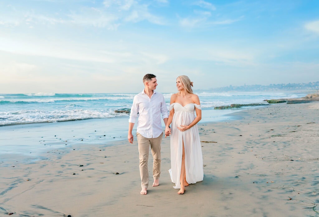 10 Essential Tips to Prepare for Your Carlsbad Maternity Photography Session 6 Carlsbad maternity photographer captures couple on the beach